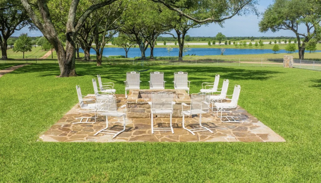 Outdoor seating with fire pit overlooks one of two ponds at Goodthyme Farm. (Photo by Kerry Kirk Photography) 